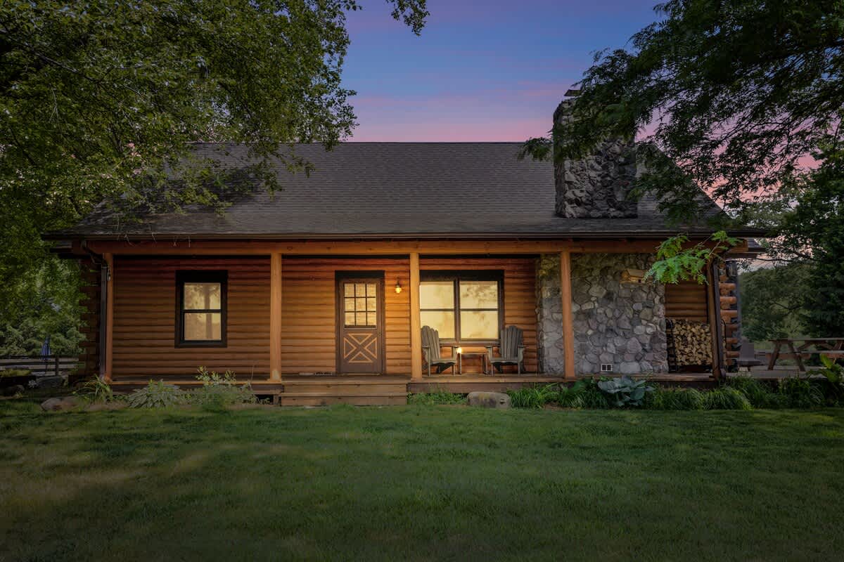 Escape to the rustic charm of Scout’s Haven, an inviting cabin nestled amidst the picturesque Indiana farmland.