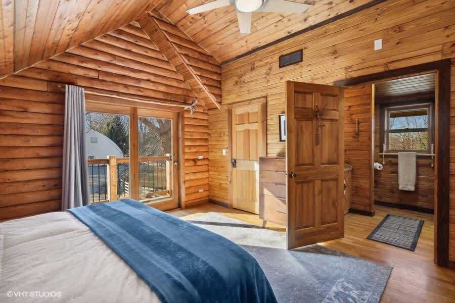 Primary bedroom is on the upper level and has a king-size bed.