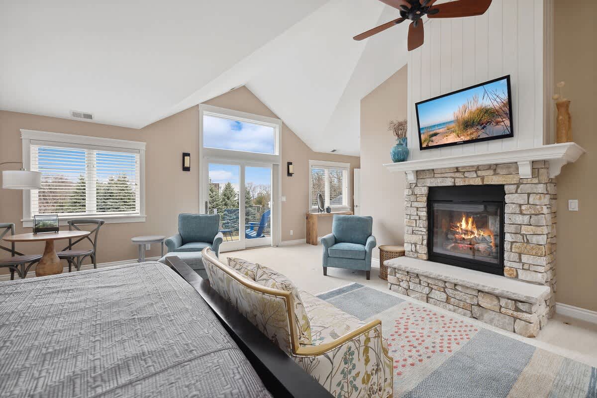 With a cozy fireplace and balcony, this space is the perfect escape from the stresses of daily life.