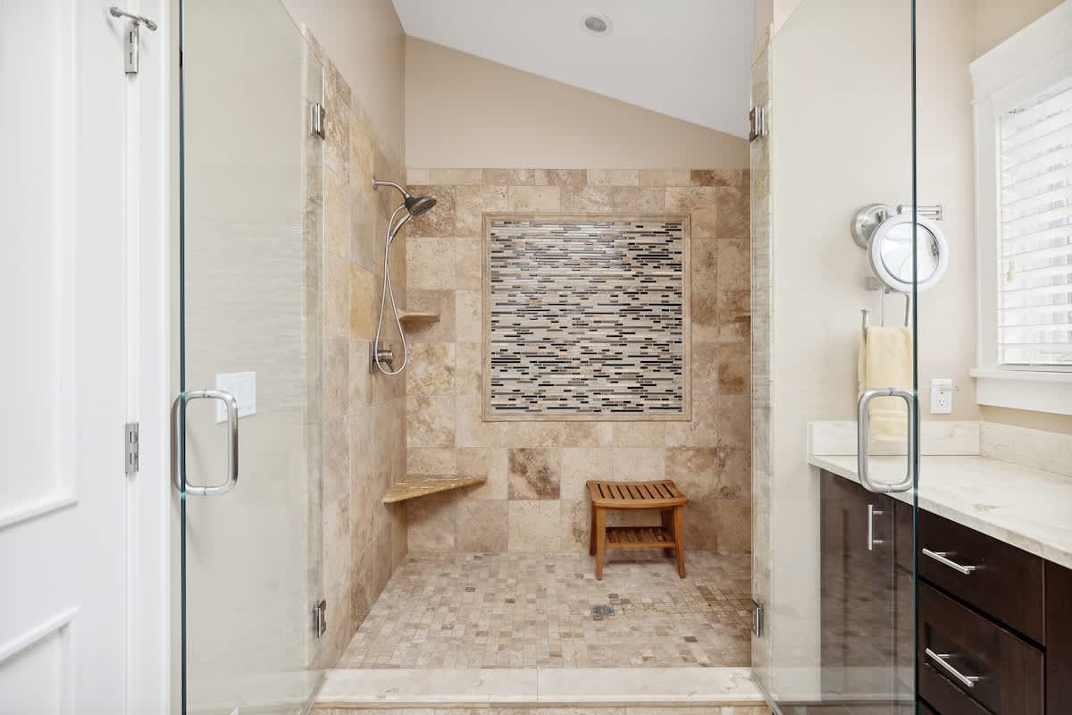 There’s plenty of room for everyone in this bathroom with sleek features and ample counter space.