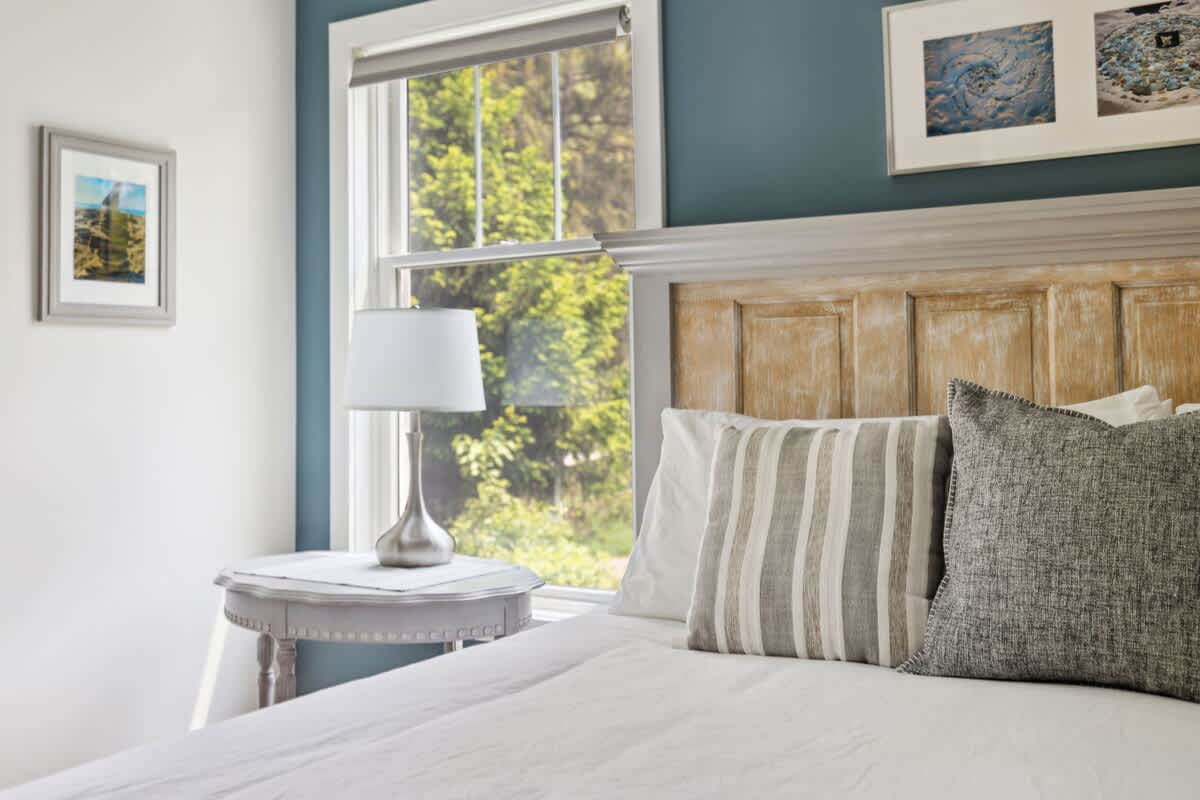 Primary bedroom is on the main level & has a king-size bed.