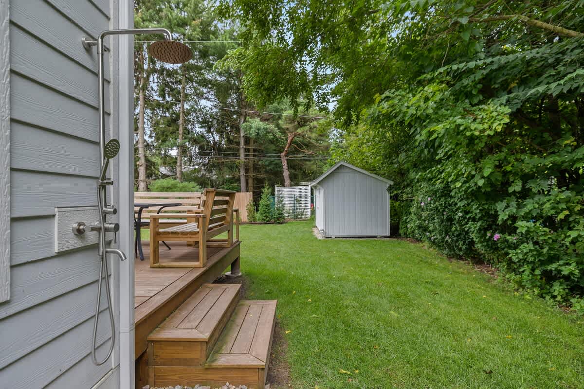 The outdoor shower is so convenient after a day at the lake.