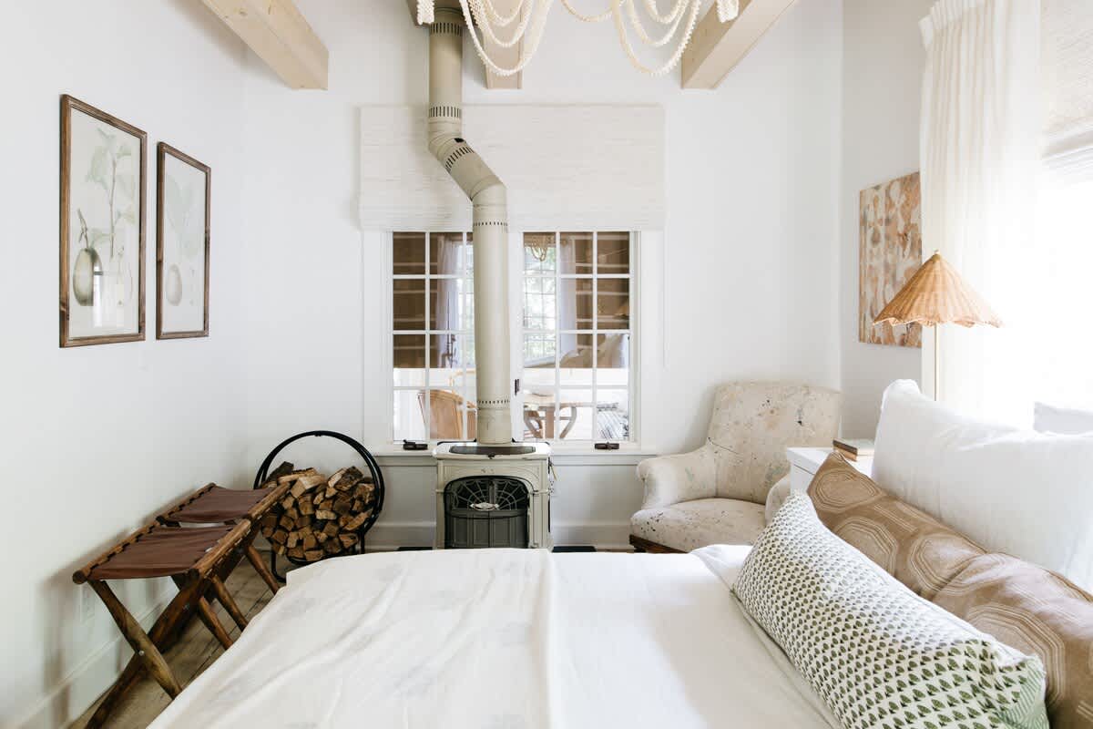 A free-standing, wood-burning fireplace keeps the room cozy during cooler nights.