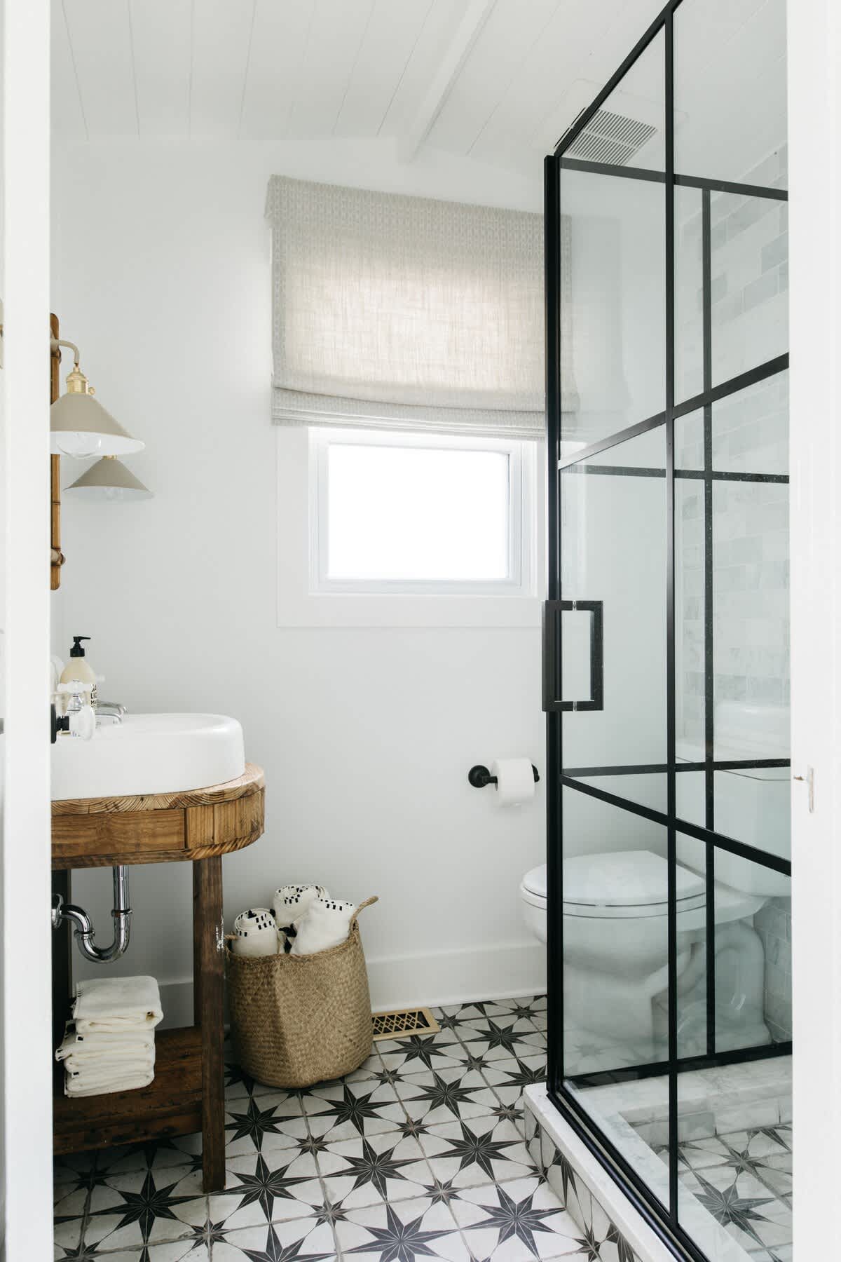 The cottage's second bathroom has a modern walk-in shower.