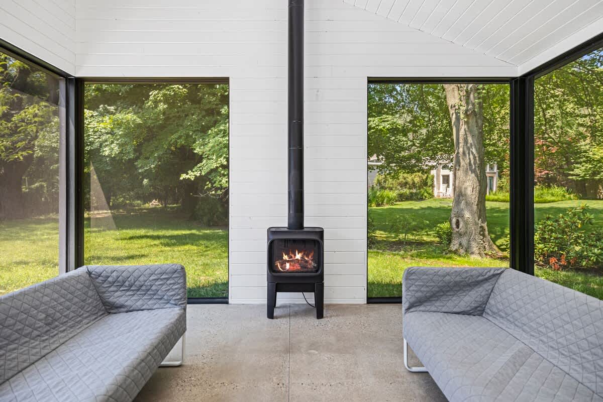 An electric fireplace keeps the ambiance warm on cool evenings.