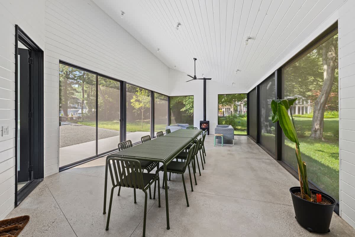 Transition to the screened porch for additional outdoor living space.