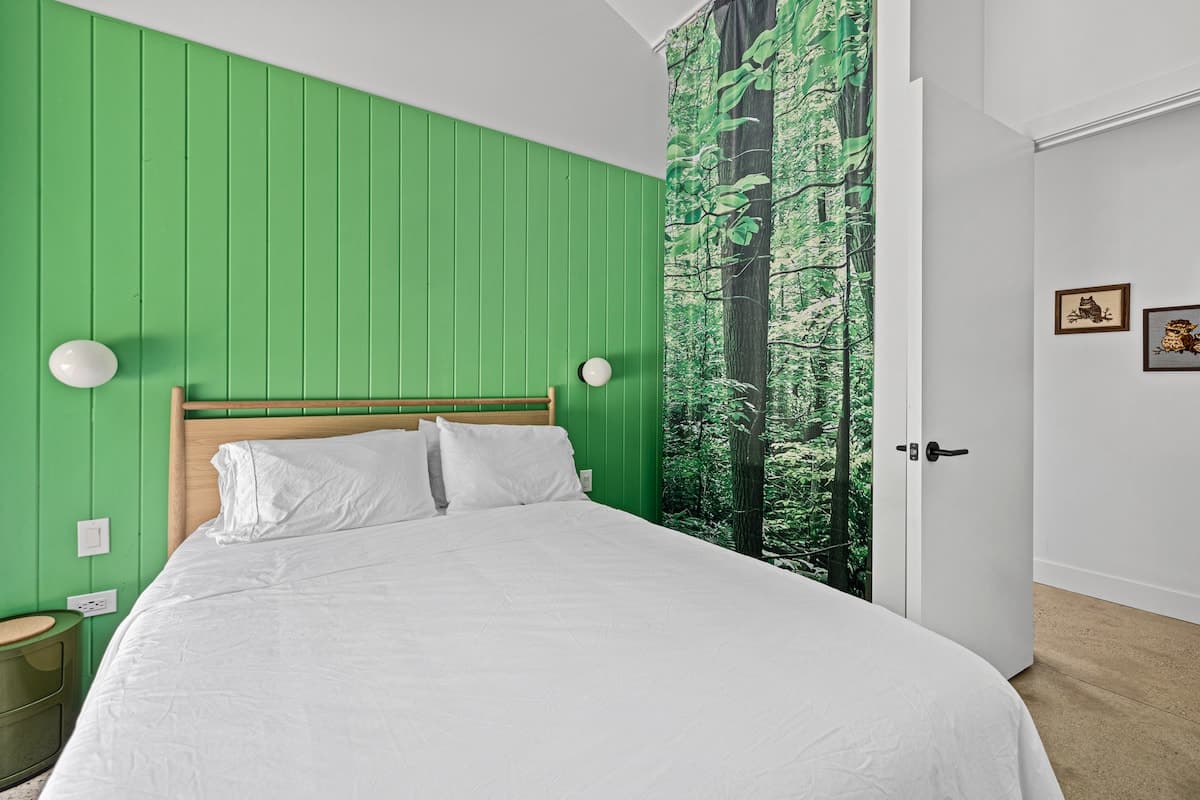 Bedroom 3 has a queen bed and courtyard access.