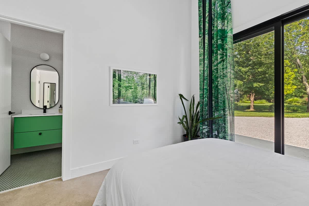 Every bedroom in Owlwood has gorgeous drapes with a photo of Harbert Woods imprinted on them.