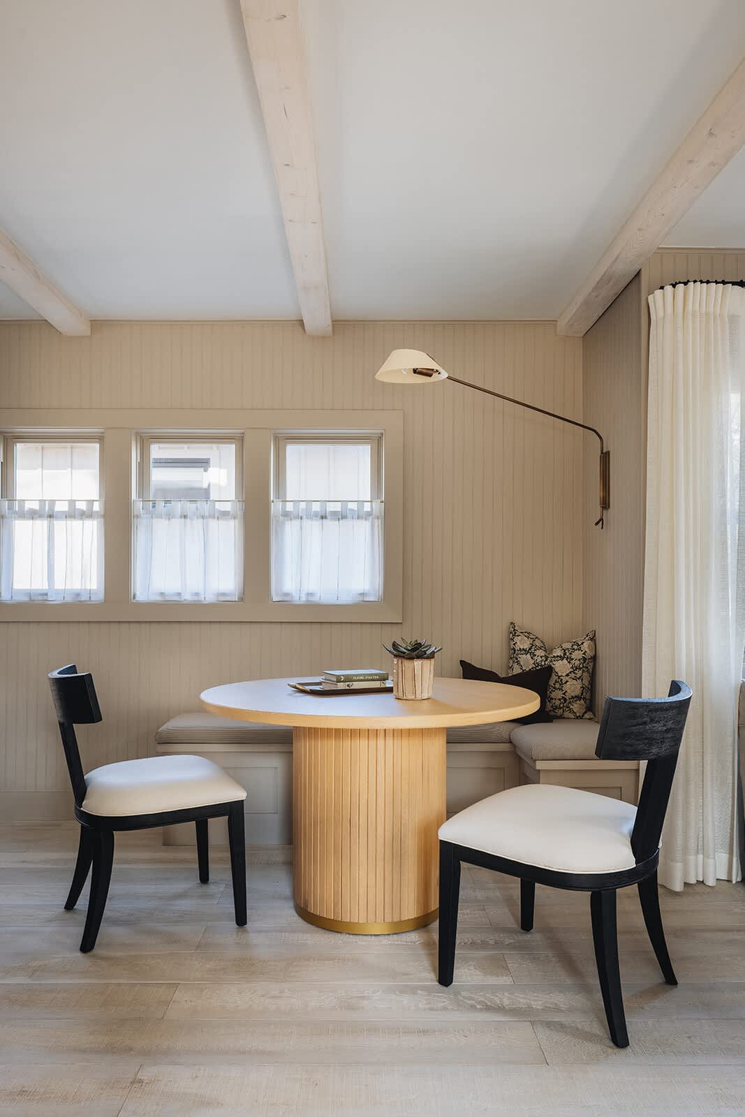 The sweet breakfast nook can double as a game table for you and your guests.