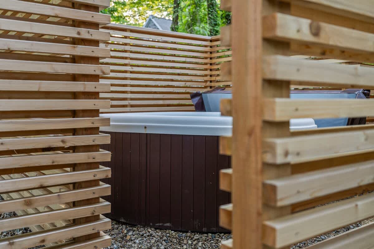Soaking up the good vibes in this cozy wooden hot tub.