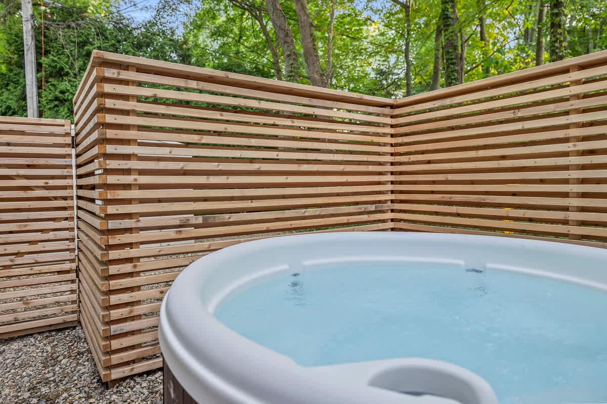 Surrounded by nature, soaking in the warmth of this wooden hot tub is pure bliss.
