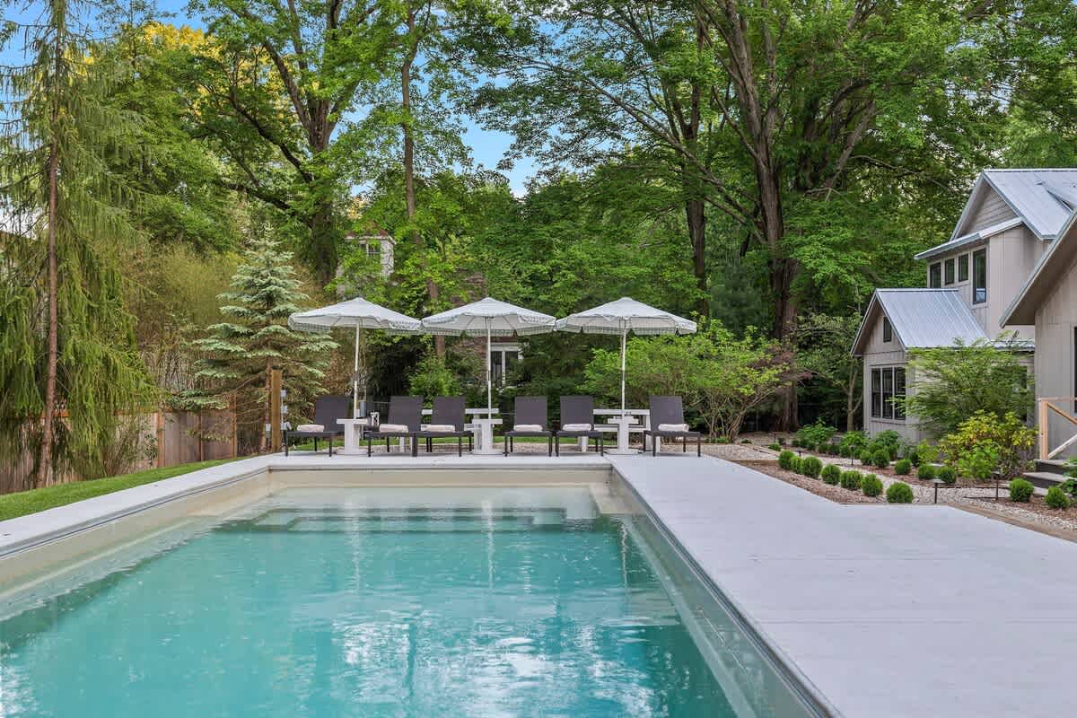 With a pool to cool off and a lawn to lounge on, every day feels like a vacation.