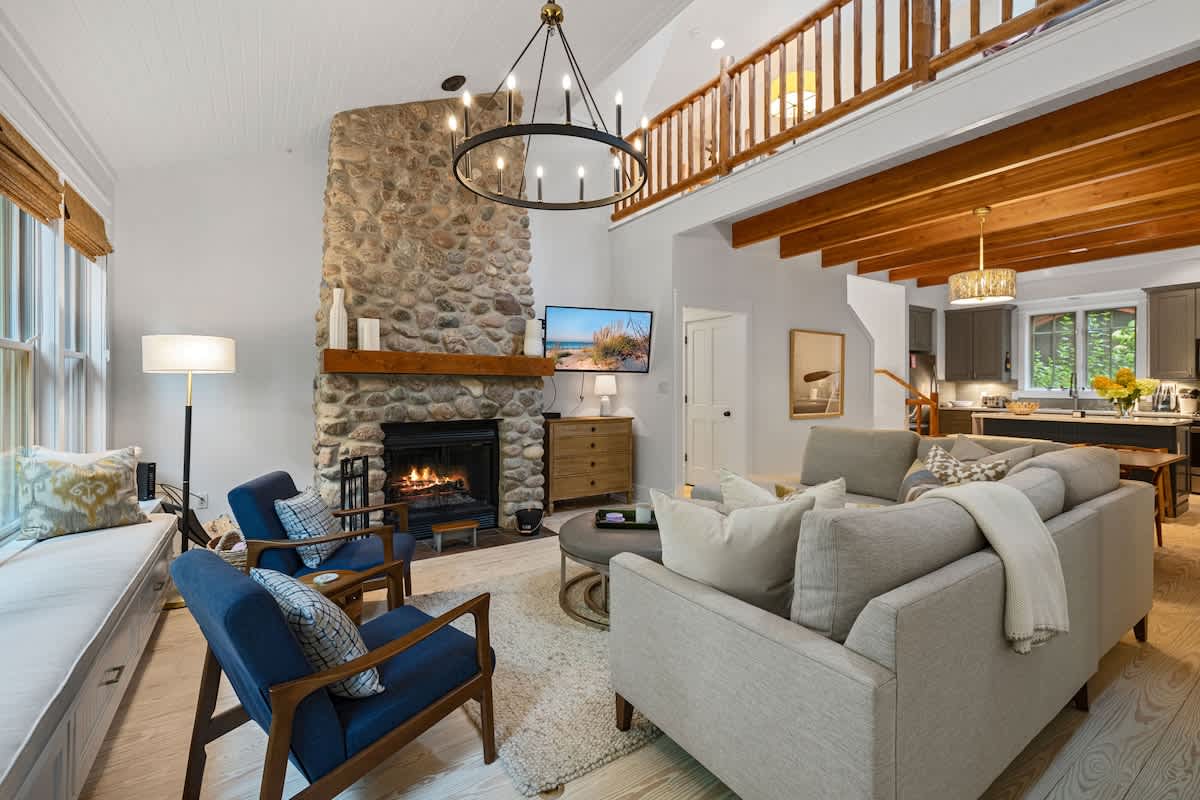 Our living space has a cozy and inviting vibe with stone fireplace.
