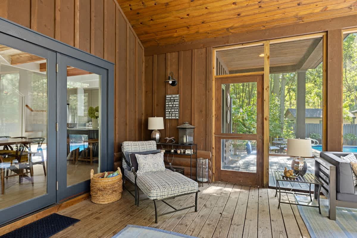 Comfortable seating options within the enclosed porch to relax on.