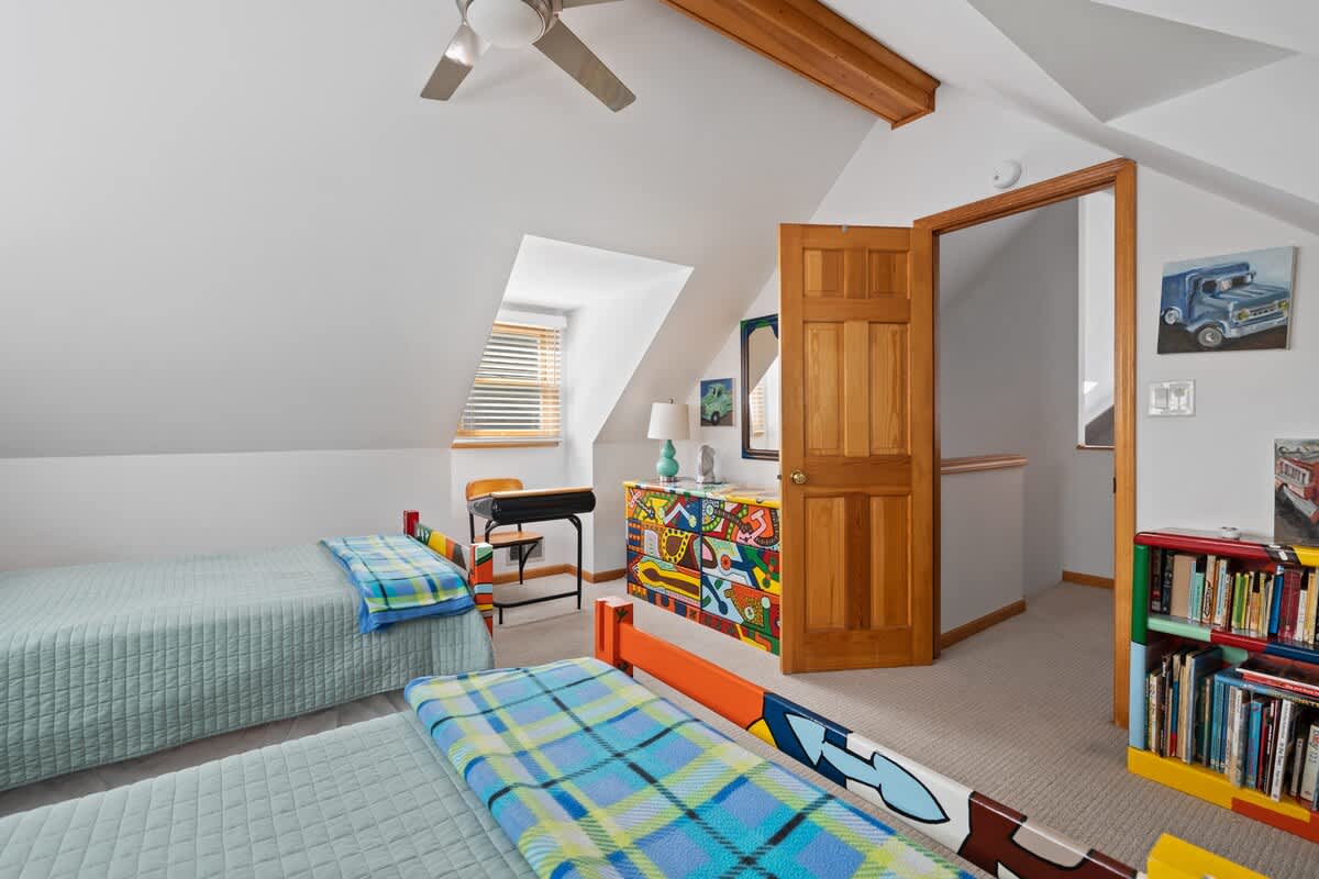 Two twin beds with vibrant colors, positioned side by side.