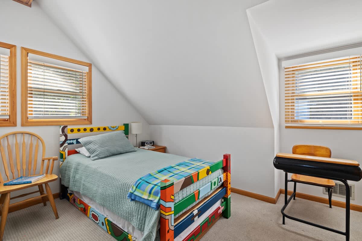 One of the two spunky colorful twin beds.