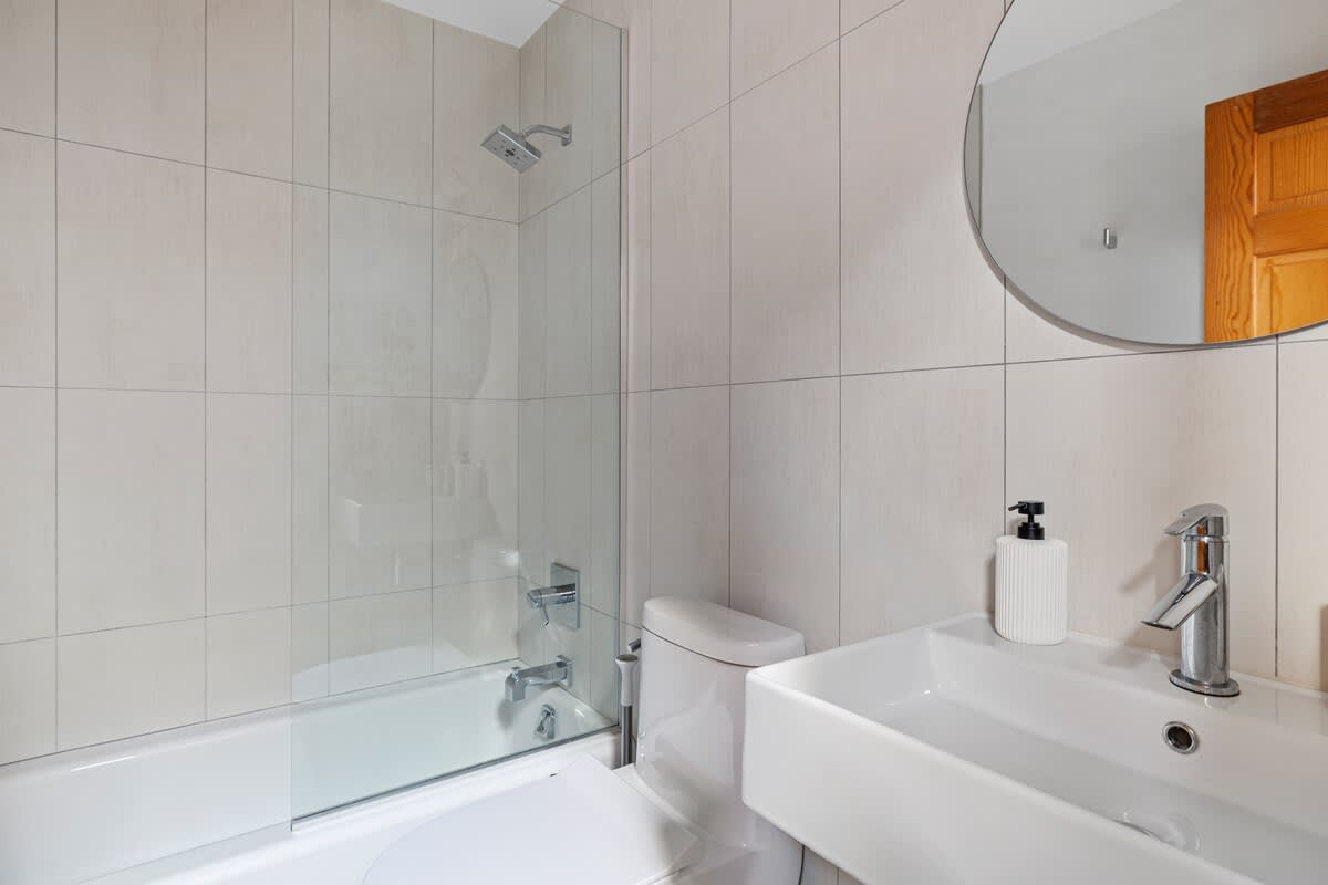 The second full bath is downstairs and has a shower/tub combo.