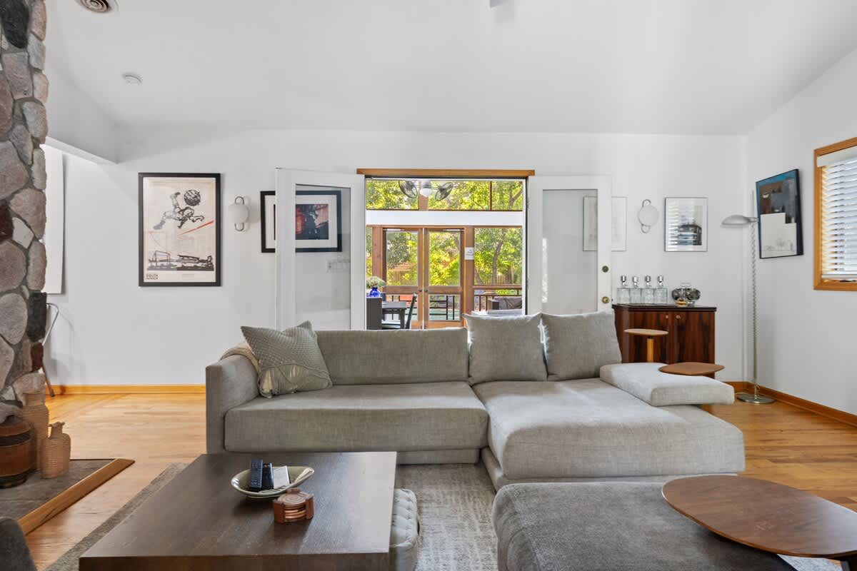 The main living area features natural light, and plenty of comfortable seating to relax.