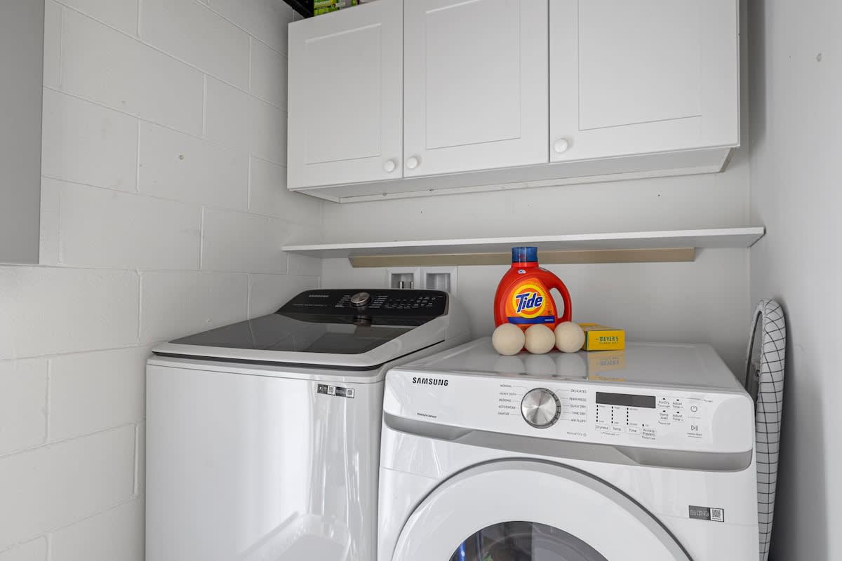 The laundry room has a high-quality washer and dryer, plus the essentials.