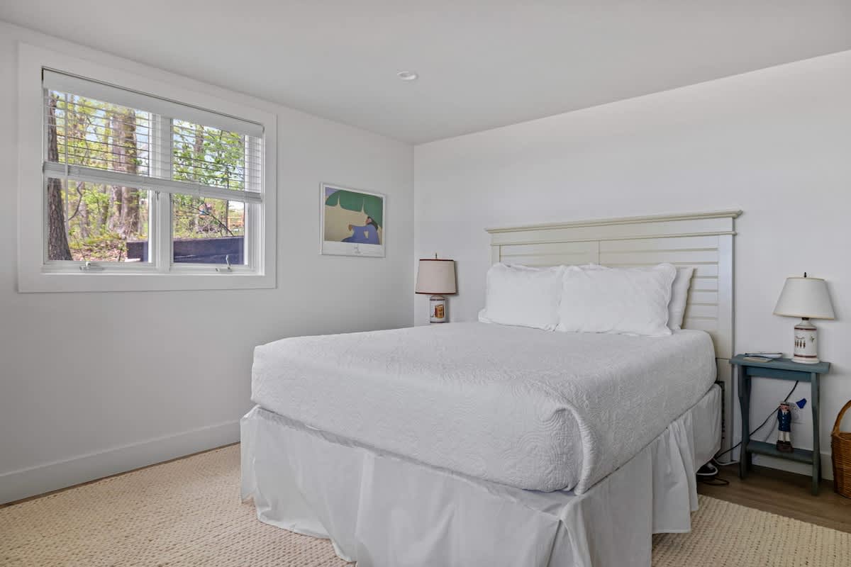 Bedroom 6 is on the main level & has a queen-size bed.