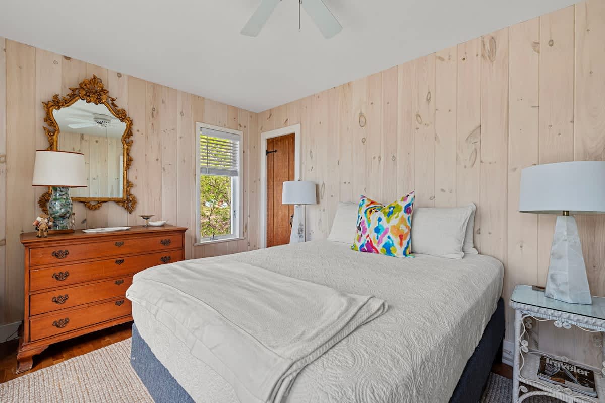 Bedroom 2 is on the main level & has a queen-size bed.