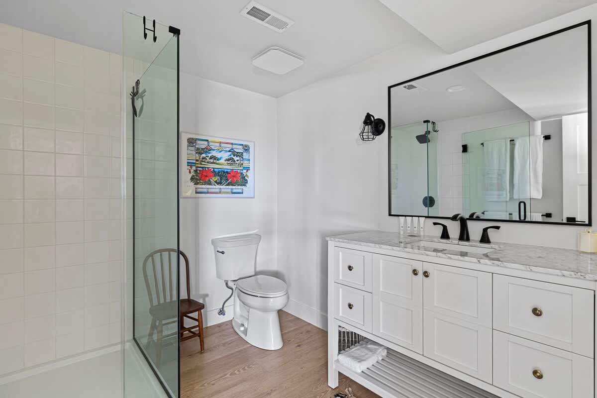 We love this bathroom's roomy walk-in shower and extra-wide stone-top vanity.