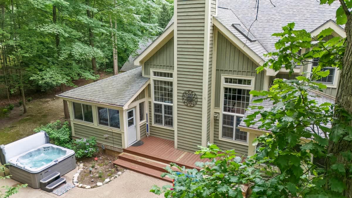 Surrounded by SW Michigan woods, this home's marvelous magic invites you in.