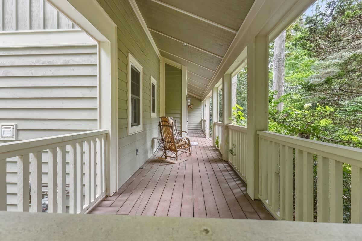 Gently rockin' on a porch in a one-of-a-kind rocking chair. Vacation Heaven.