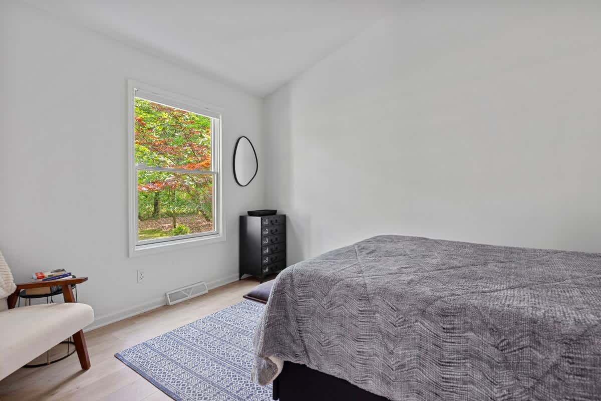 This winsome bedroom has a vaulted ceiling, nice view and a comfy queen bed.