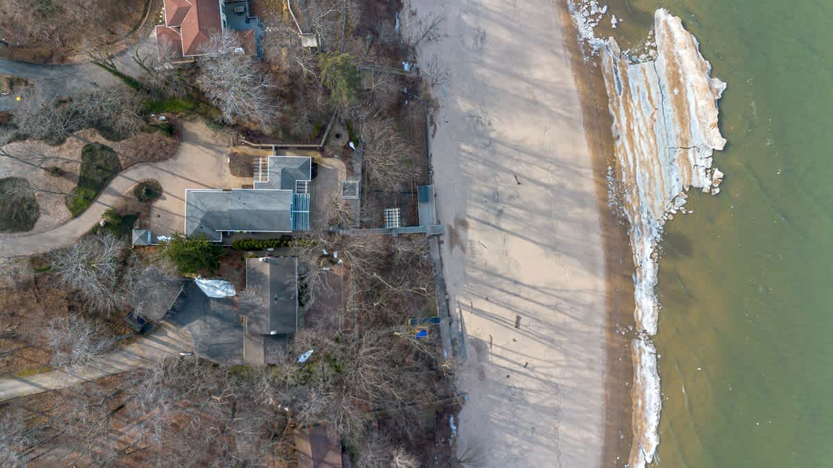 Aerial photo in winter of Sunset Shores Sanctuary and the Lake Michigan beach.