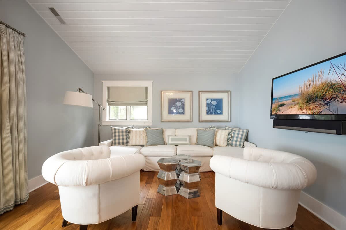 The Master Bedroom features a sweet den with comfy seating and a flat-screen TV.