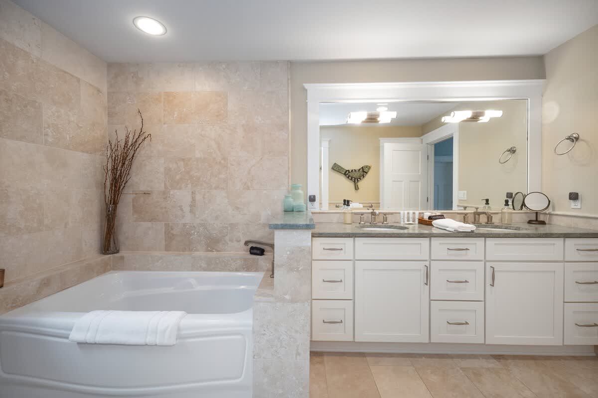 Luxurious tile and deluxe fixtures highlight the rich Ensuite Master Bathroom.