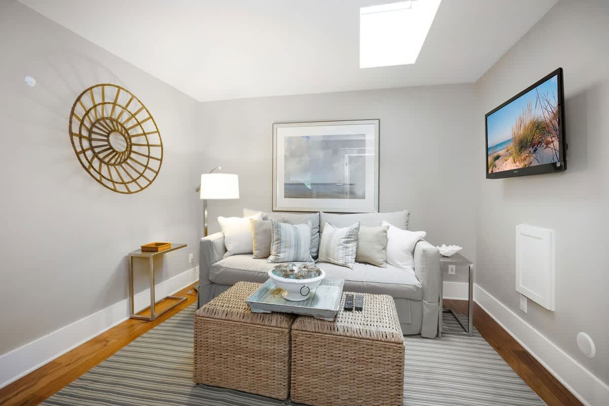 The main floor has a nicely appointed sitting room with a flat-screen TV. Chill?