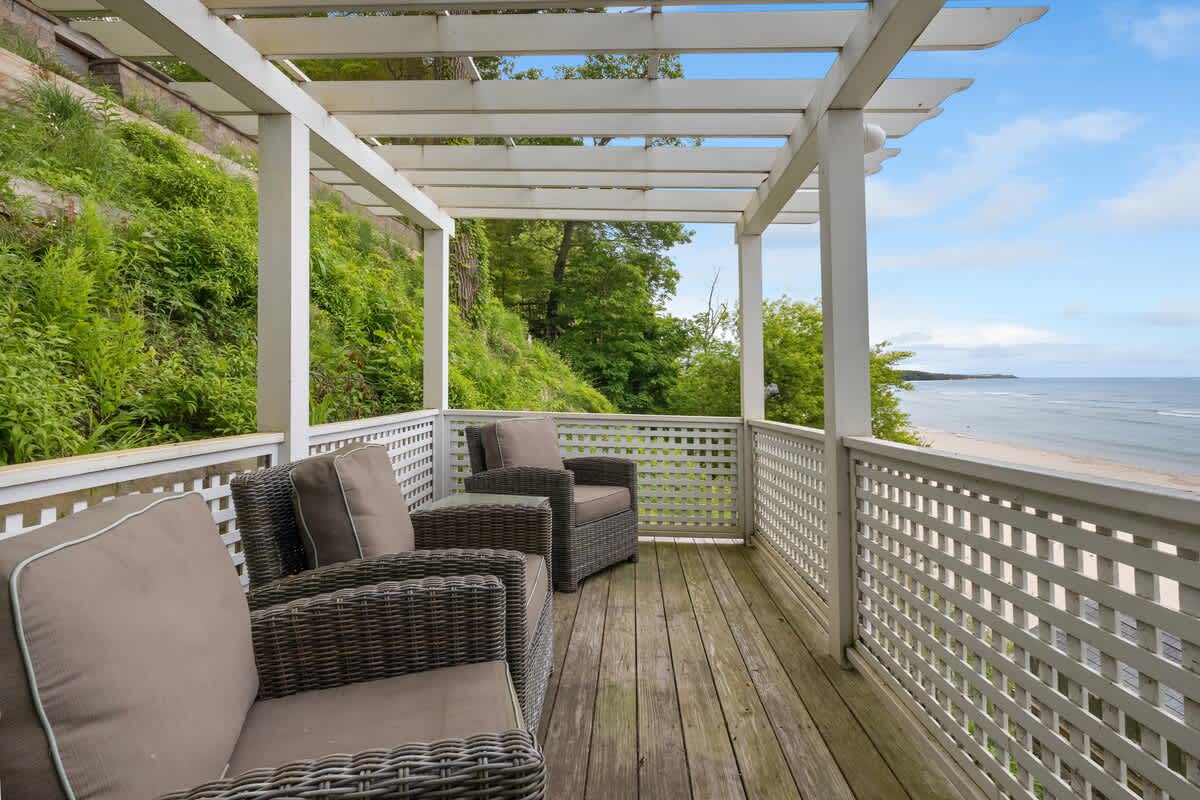 Relax beneath the pergola with ocean on the horizon.