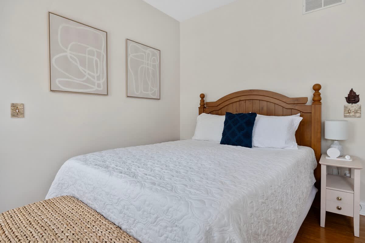 Bedroom 2 is on the main level & has a queen-size bed.