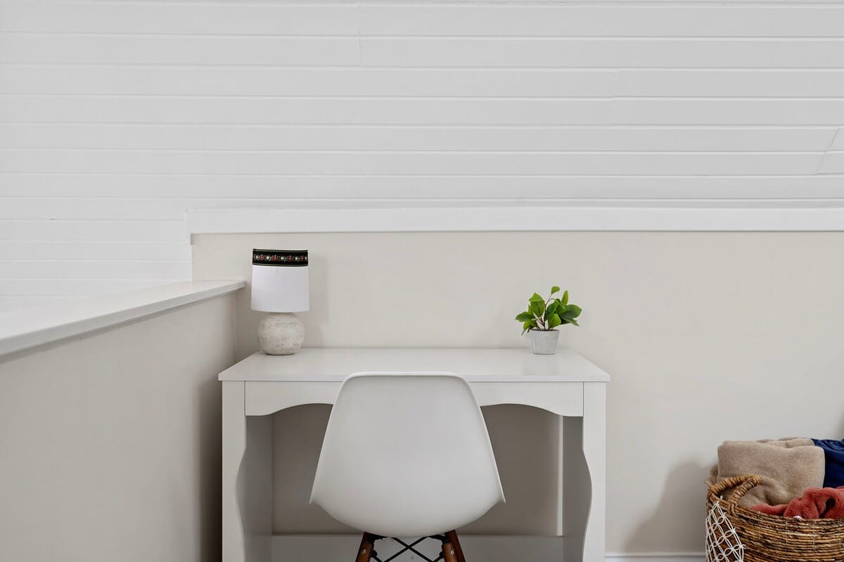 The upstairs has a family room area with a cute desk or laptop space.
