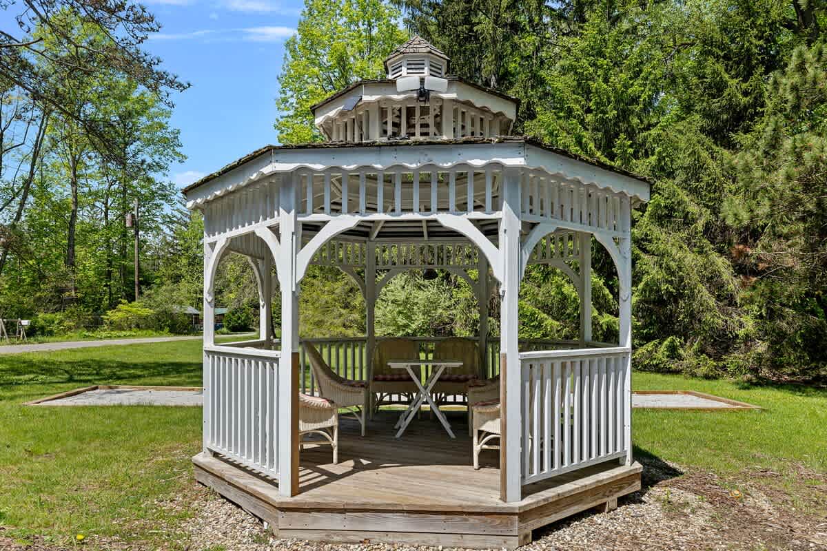 A coolio gazebo with 6 comfy chairs. Listening to bird-songs. Yep, life is good.