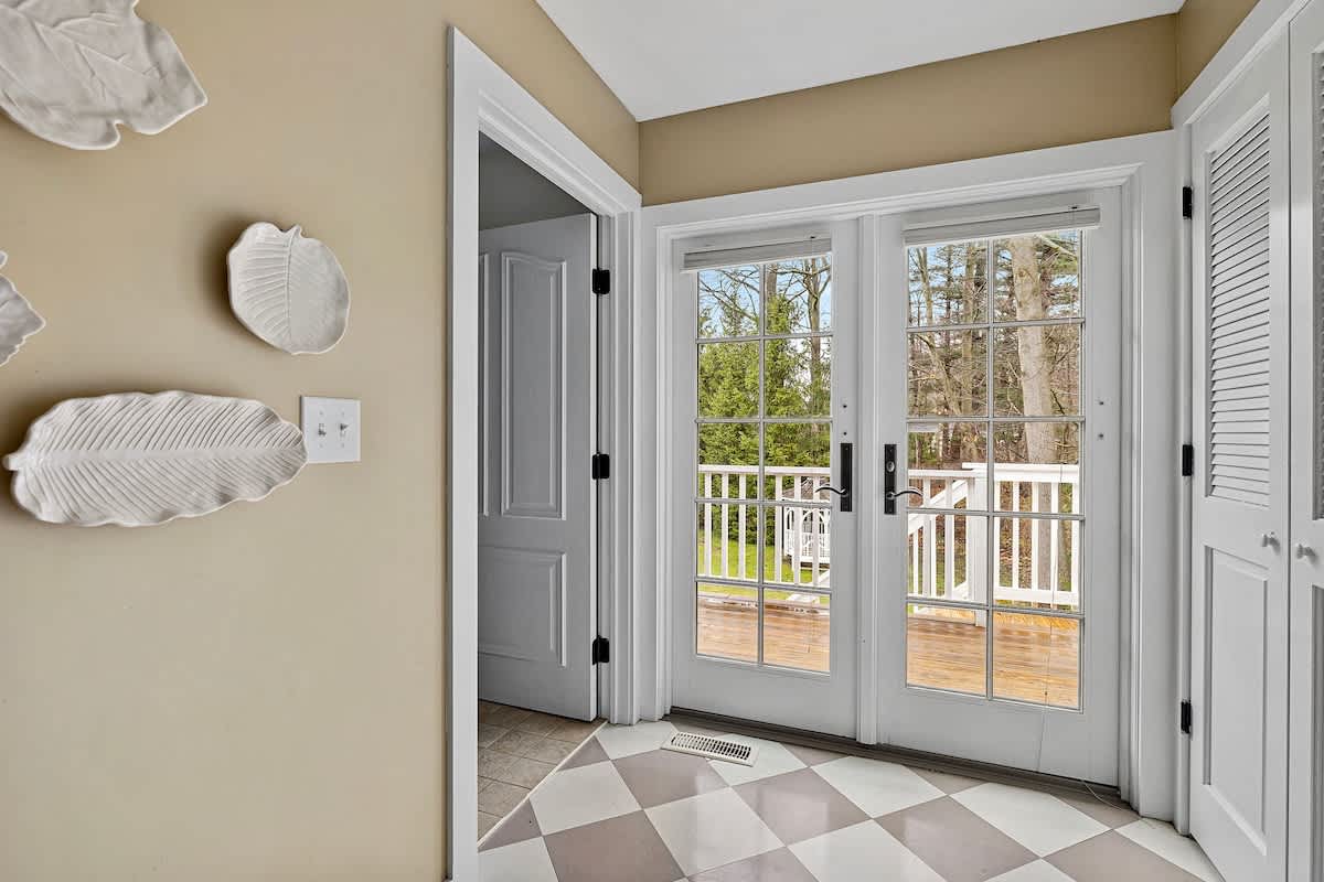 Yep, this bedroom will tickle you, having access to the deck via French doors.