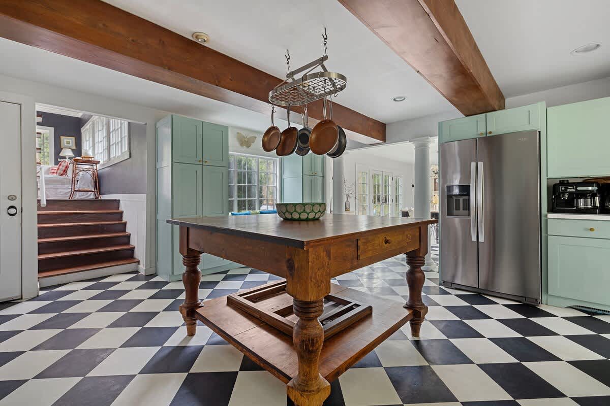 This magnificent island table makes for a great coffee spot in the morning.