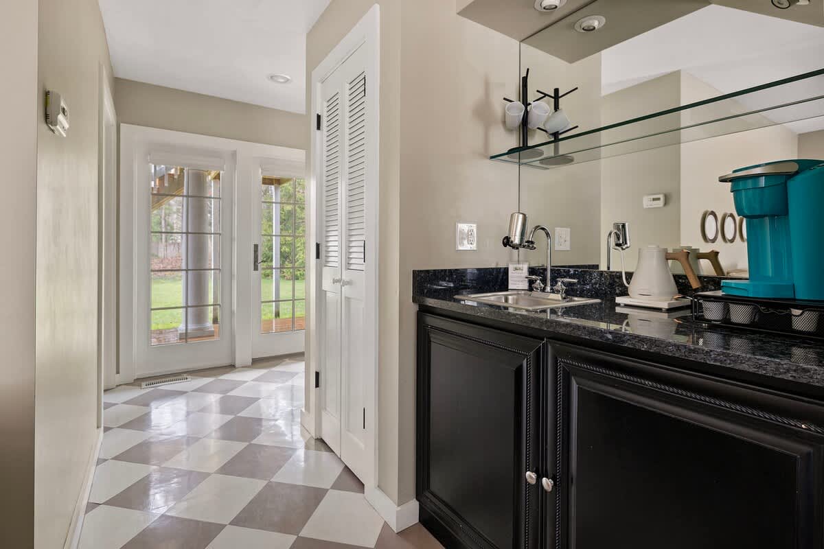 Sweet extras with this bedroom? A mini-kitchenette and some primo coffee or tea.