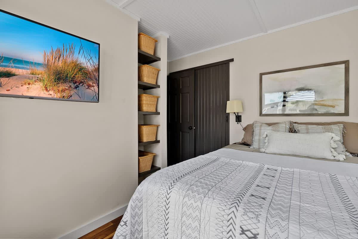 The Primary bedroom has a queen-size bed.