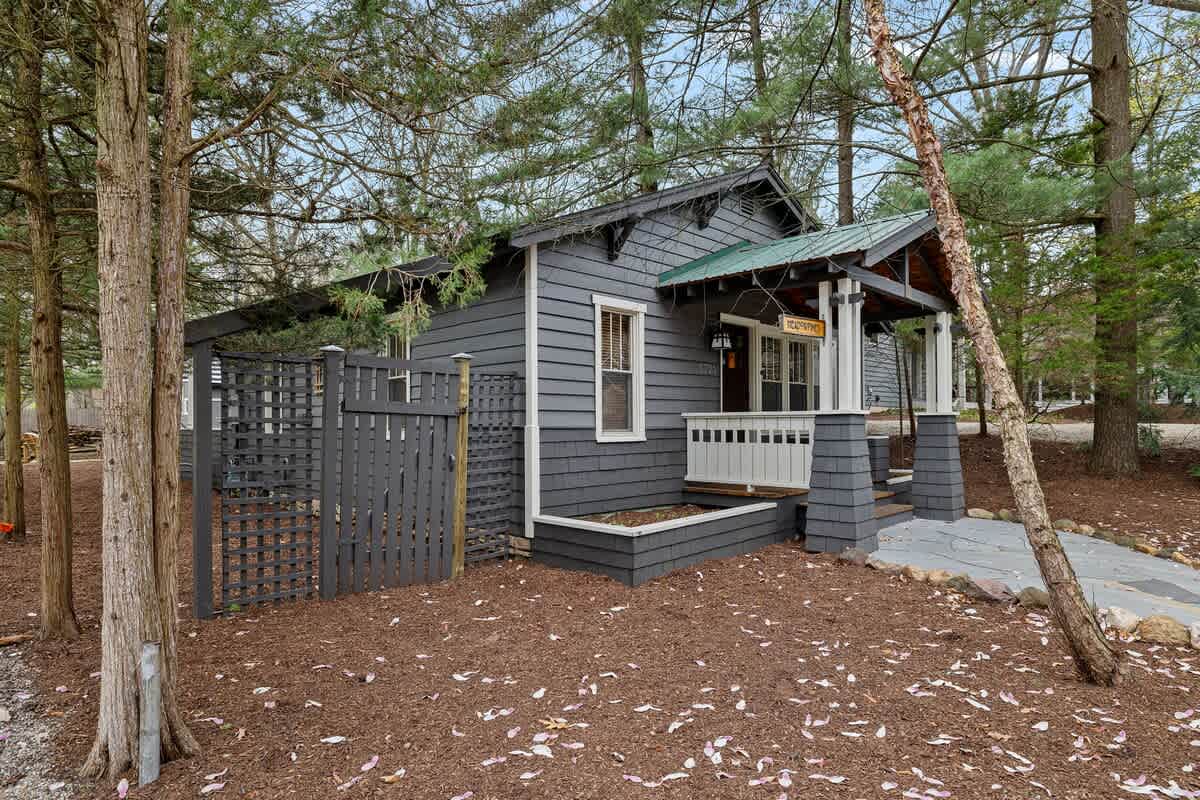 Being set on a quiet corner lot surrounded by pine trees has its advantages.