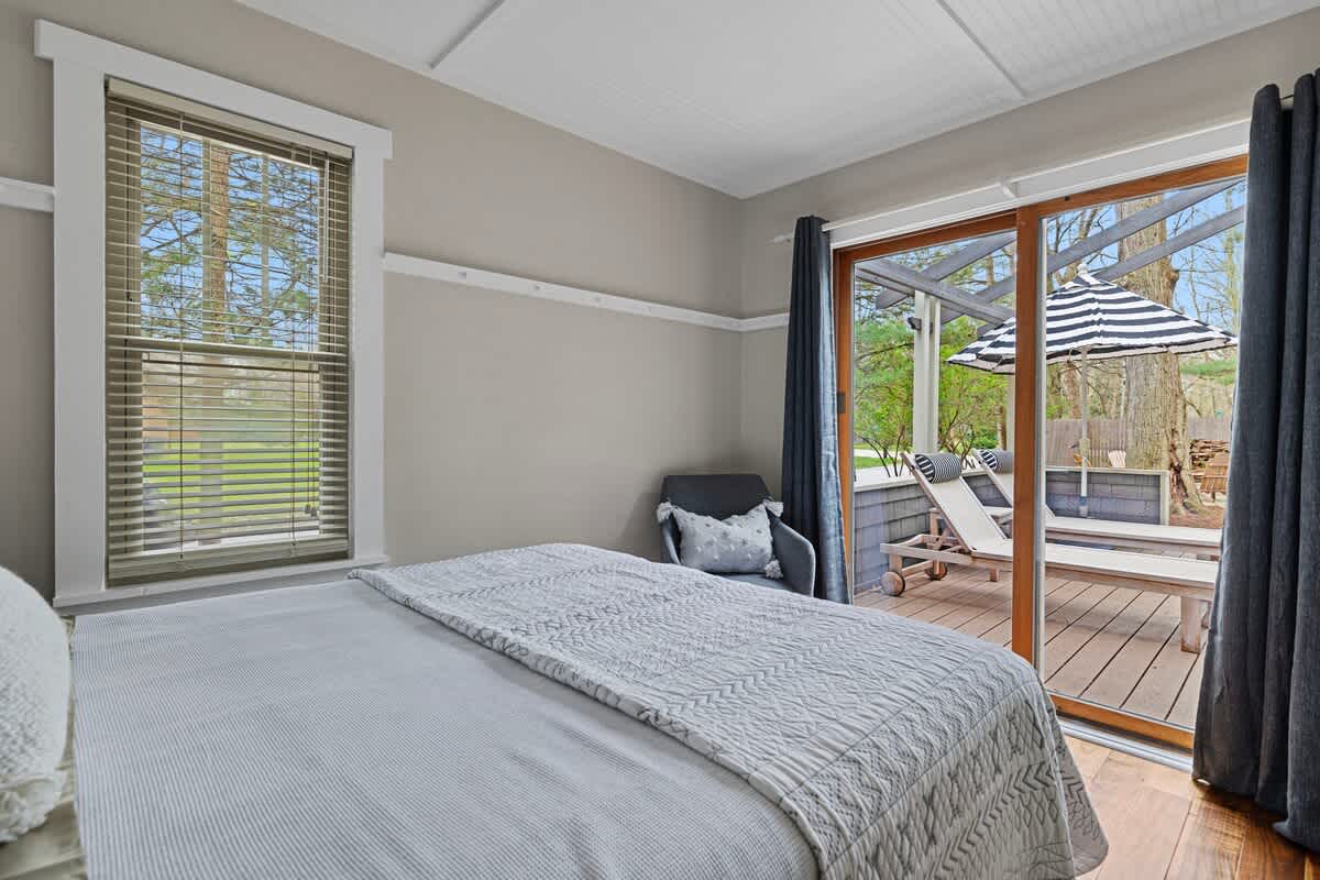 This bedroom has easy-peasy access to the fire-side ready deck. Ooh-la-la!