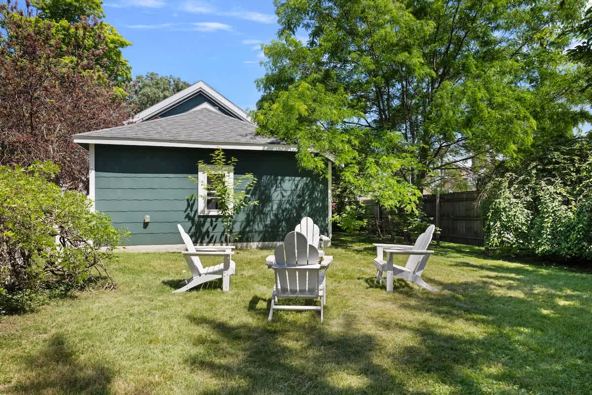 Chillin' in this backyard paradise, where the grass is always greener and the chairs are always ready for a fireside chat!