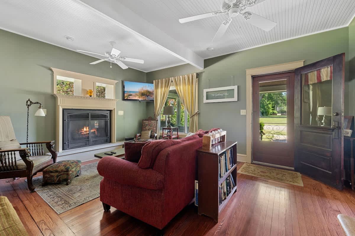 Cozy living room vibes with a warm fireplace and vintage charm.