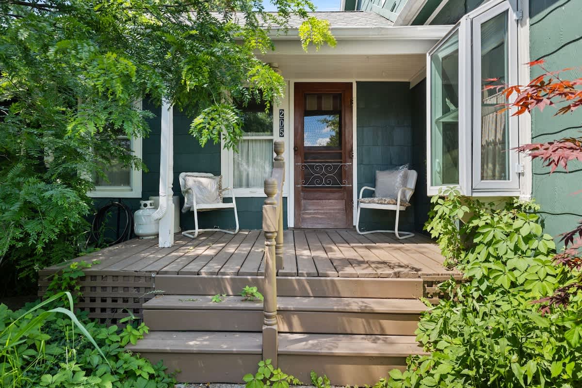 Enjoy tranquil mornings and peaceful evenings on this charming porch.