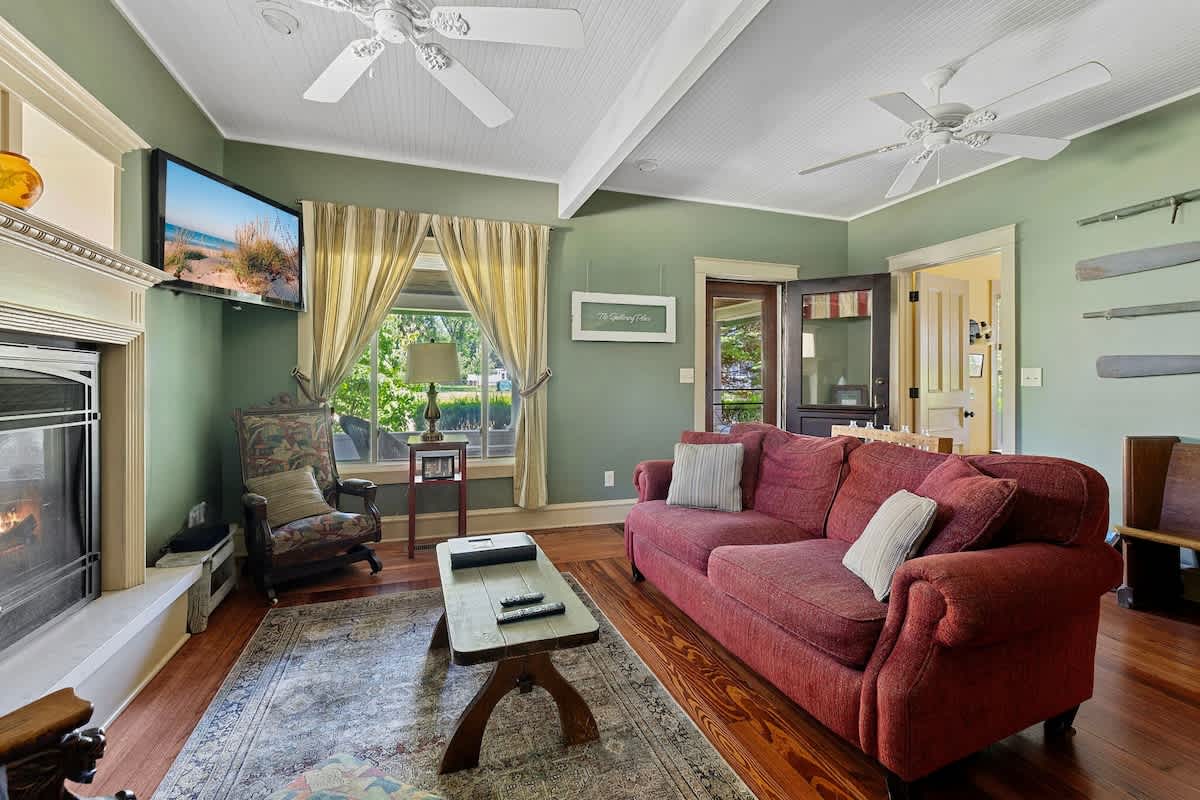 Relax and unwind in this inviting living room filled with natural light.