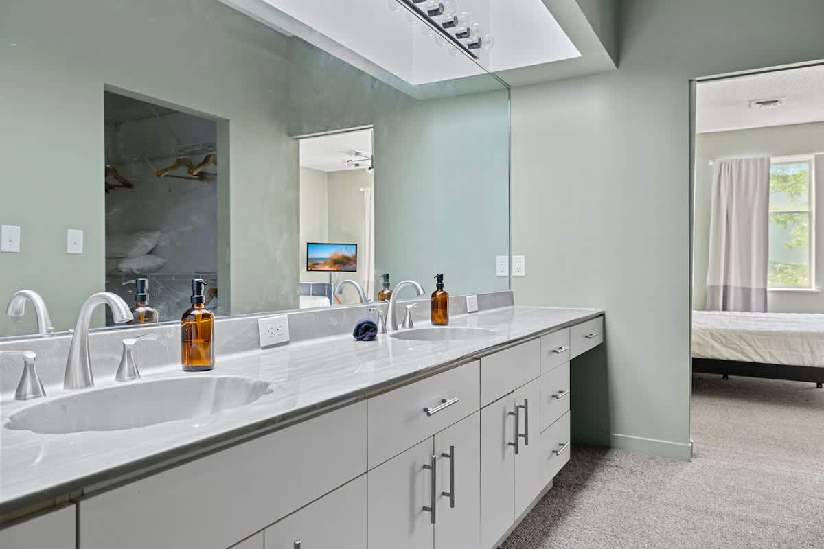 Morning routines are made easy with this sleek double vanity!