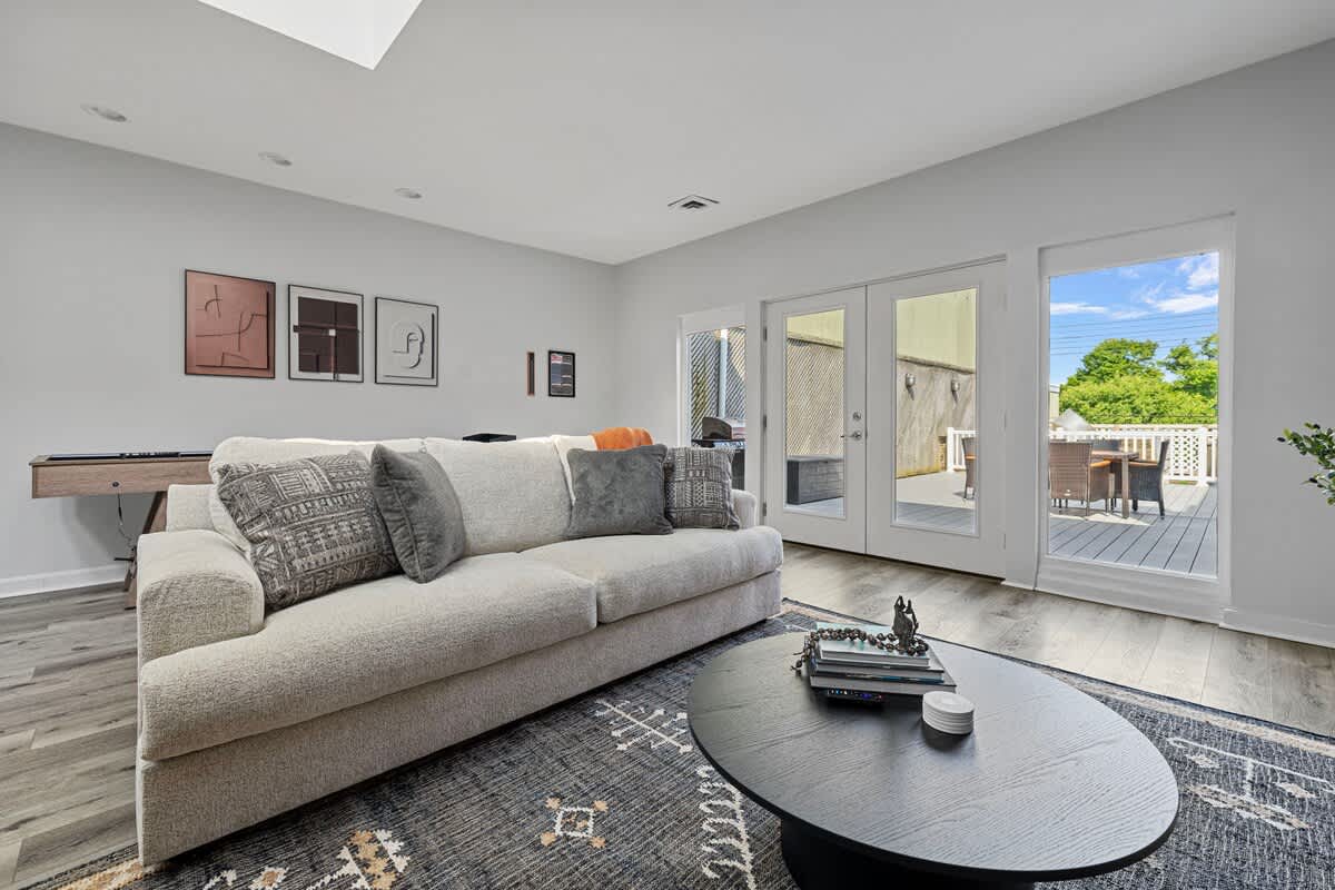 Bringing the outdoors in with this stunning skylight view! Imagine lounging on this stylish couch, surrounded by natural light and good vibes.