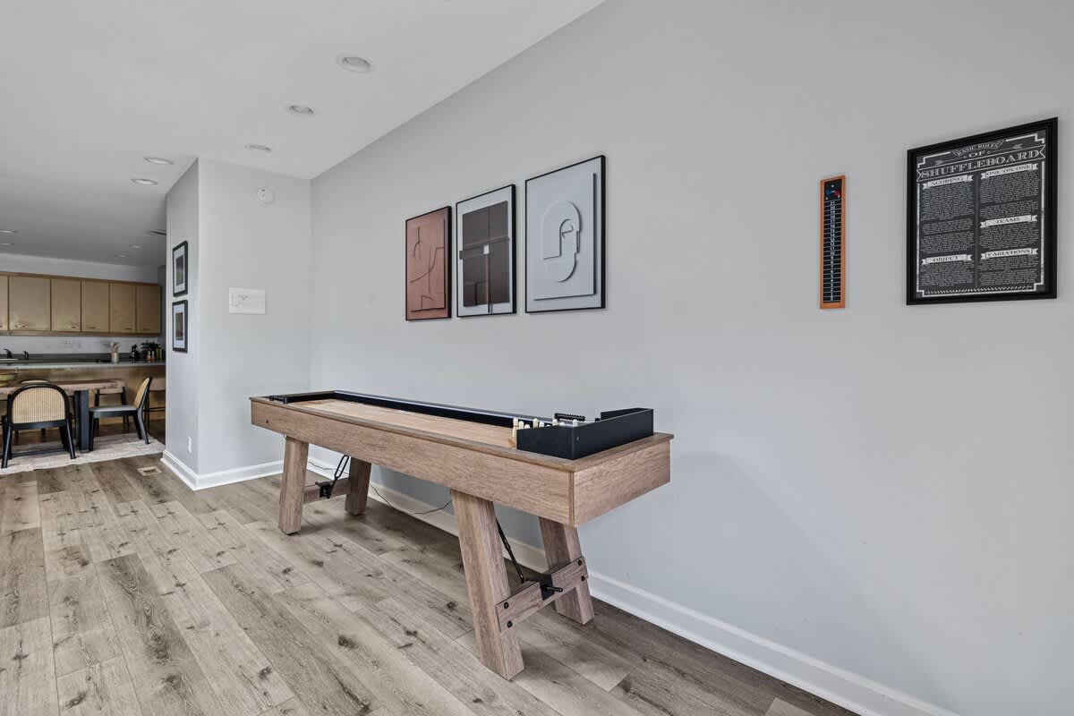 Ready, set, shuffle! Bringing the fun home with this awesome shuffleboard table.